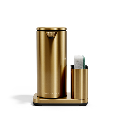 Simplehuman Brass 14 oz Sensor Pump + Caddy, touch-free rechargeable dispenser holding a sponge.