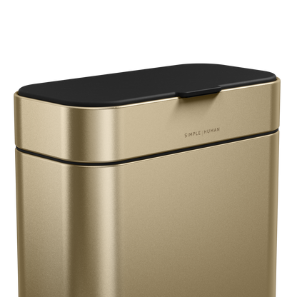 Detail view of Simplehuman Brass Compost Caddy showing the flush lid and branding for an odor-proof seal.